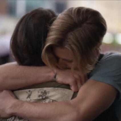 Alex and Willie from "Julie and the Phantoms" hugging