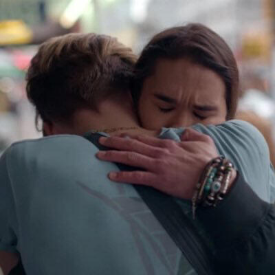 Alex and Willie from "Julie and the Phantoms" hugging